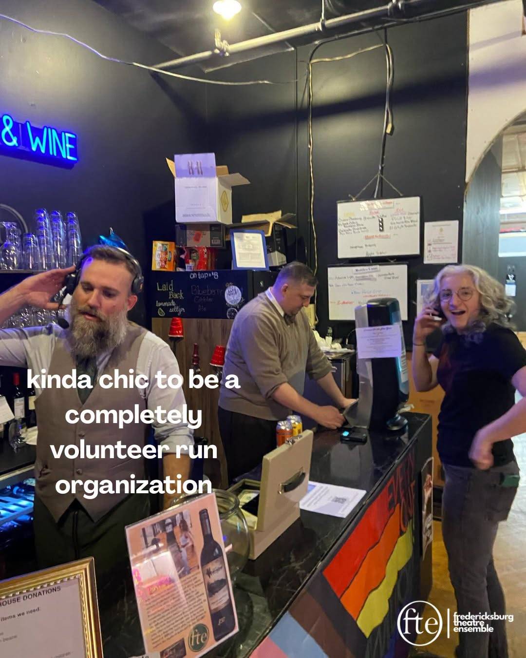 Volunteers working the FTE bar under a neon Beer & Wine sign, captioned kinda chic to be a completely volunteer run organization.
