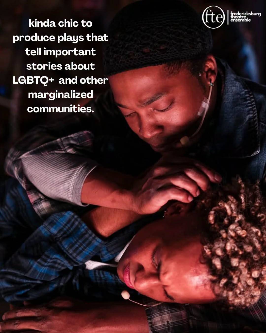 Two performers lying close together in a dimly lit scene, captioned kinda chic to produce plays that tell important stories about LGBTQ+ and other marginalized communities.