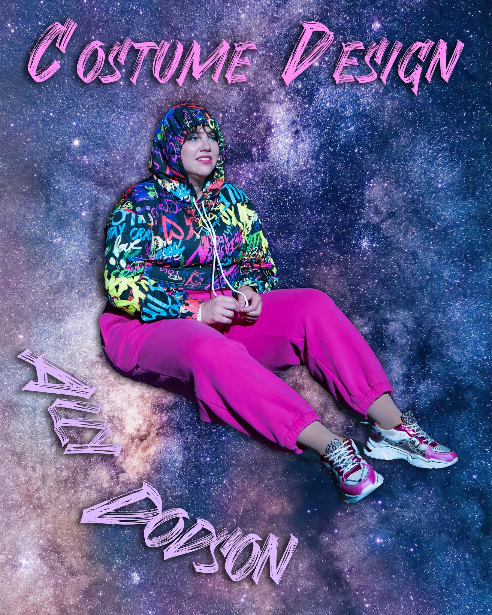 Dance Nation's costume designer poses in a colorful outfit against a galaxy backdrop.